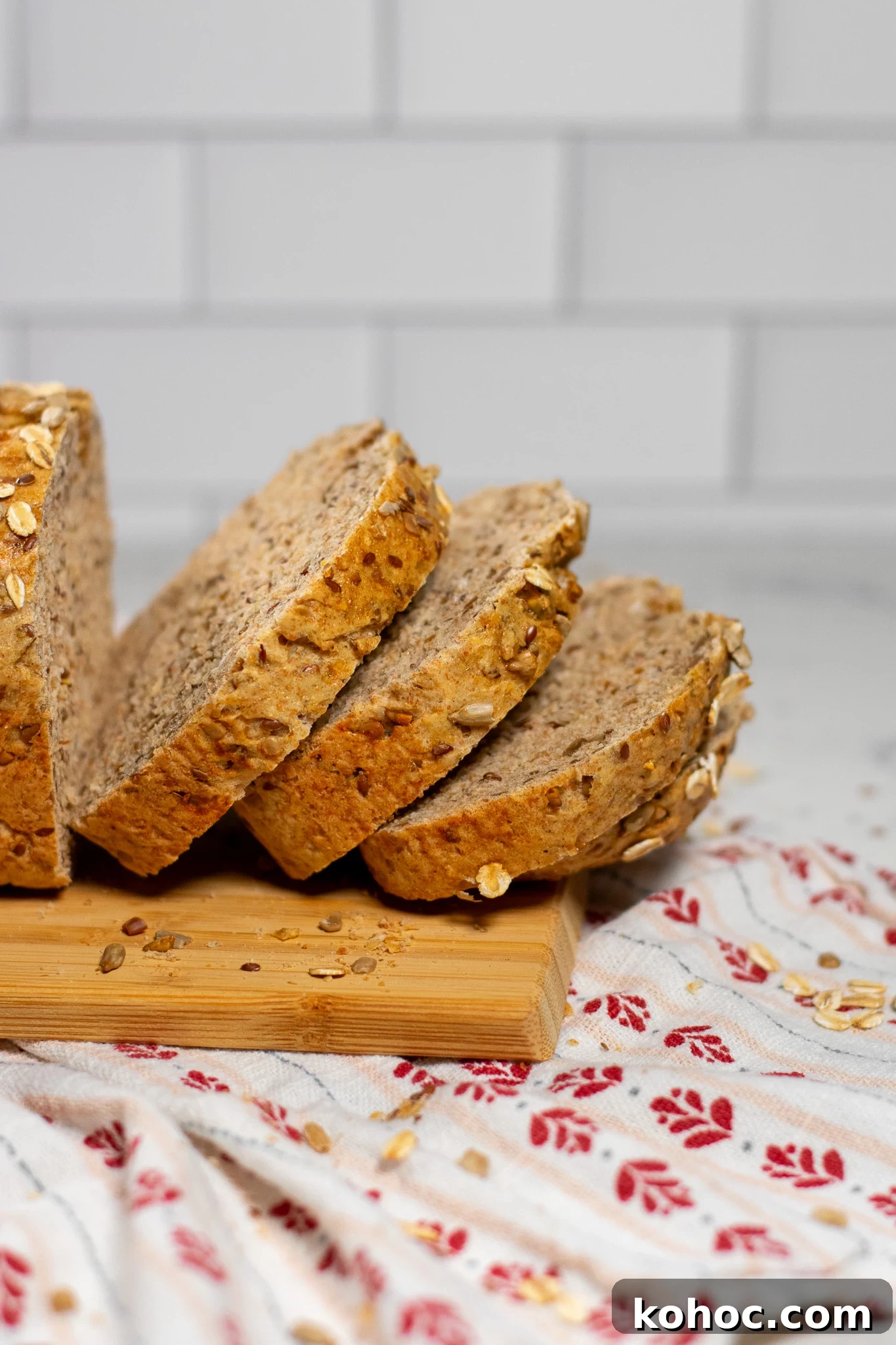 Whole Grain Loaf Recipe: Rustic Nordic Grovbrød Guide 5 Slices of whole grain bread on a cutting board.