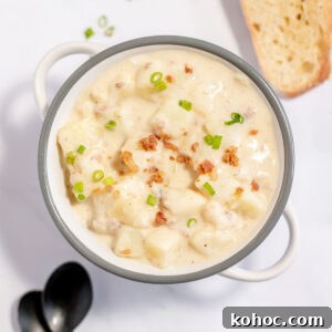 Creamy Baked Potato Soup with Crispy Bacon Topping 11 Baked Potato Soup topped with bacon bits and green onions in stock pot.