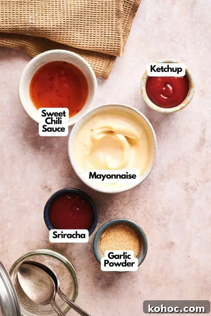 Savvy Slider Copycat Recipe: How to Make Restaurant-Style Sliders 4 Five small bowls, including a Copycat Savvy Slider sauce, sweet chili sauce, mayonnaise, ketchup, sriracha, and garlic powder, are arranged on a light surface with a brown cloth in the corner.