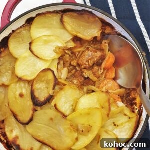 Savory Pork and Cabbage Hotpot Recipe for Cozy Weeknights 11 Pork and cabbage hotpot with some of the potatoes removed to show the inside.
