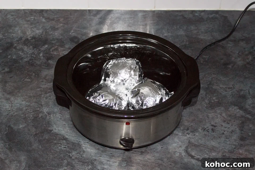 Slow Cooker Baked Jacket Potatoes Recipe 15 jacket potatoes wrapped in foil in a slow cooker