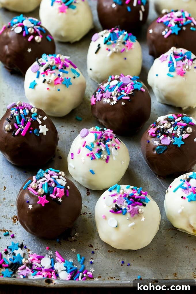 Decorated Oreo balls Assorted colors of Oreo balls on a sheet pan.
