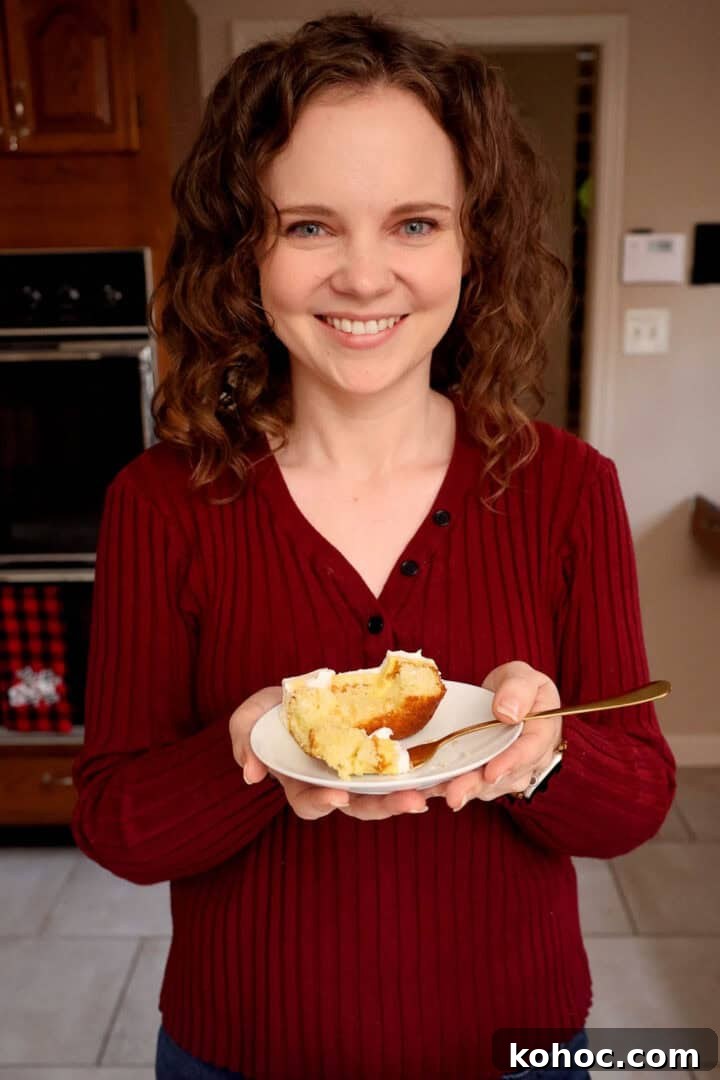 Kelsey Smith holding a plate of eggnog poke cake.