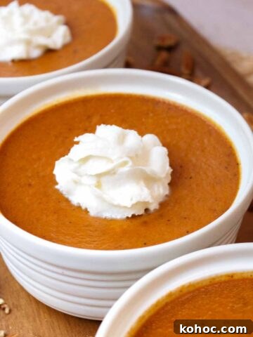 Baked pumpkin custard with whipped cream.
