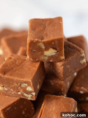 One inch squares of Velveeta fudge stacked into a pyramid.