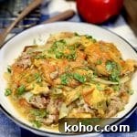 Slow-Cooker Pulled Pork Casserole with Cheesy Topping 8 Pulled pork potato casserole with cheese in a bowl.