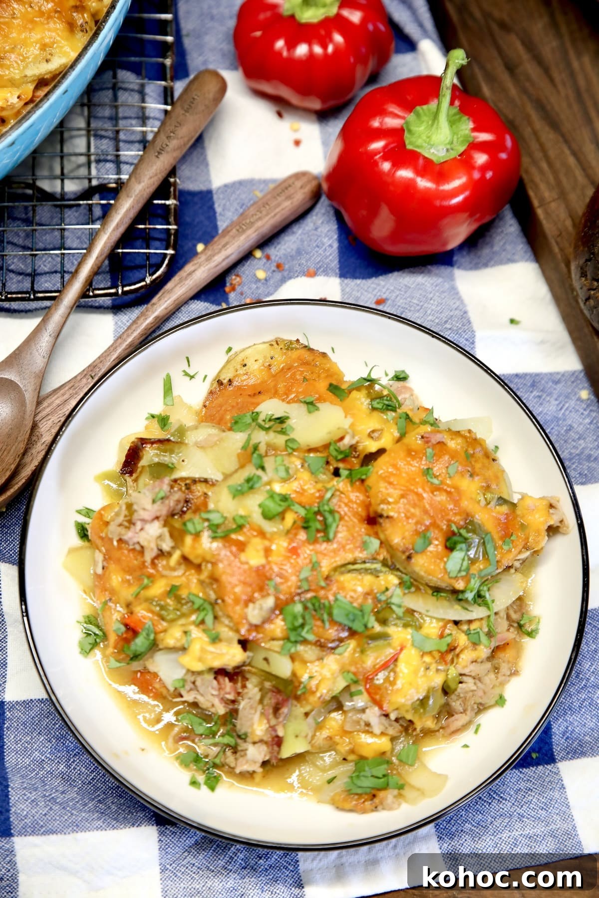 Slow-Cooker Pulled Pork Casserole with Cheesy Topping 9 Potato and pulled pork casserole in a bowl.