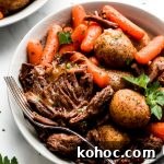 Juicy Instant Pot Pot Roast Recipe for Tender, Quick Dinner 9 Instant Pot Pot Roast in a bowl with carrots, and baby yukon potatoes.
