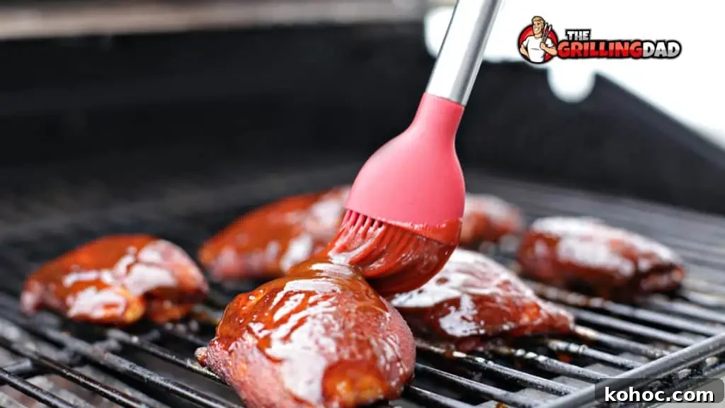 adding bbq sauce to the chicken thighs