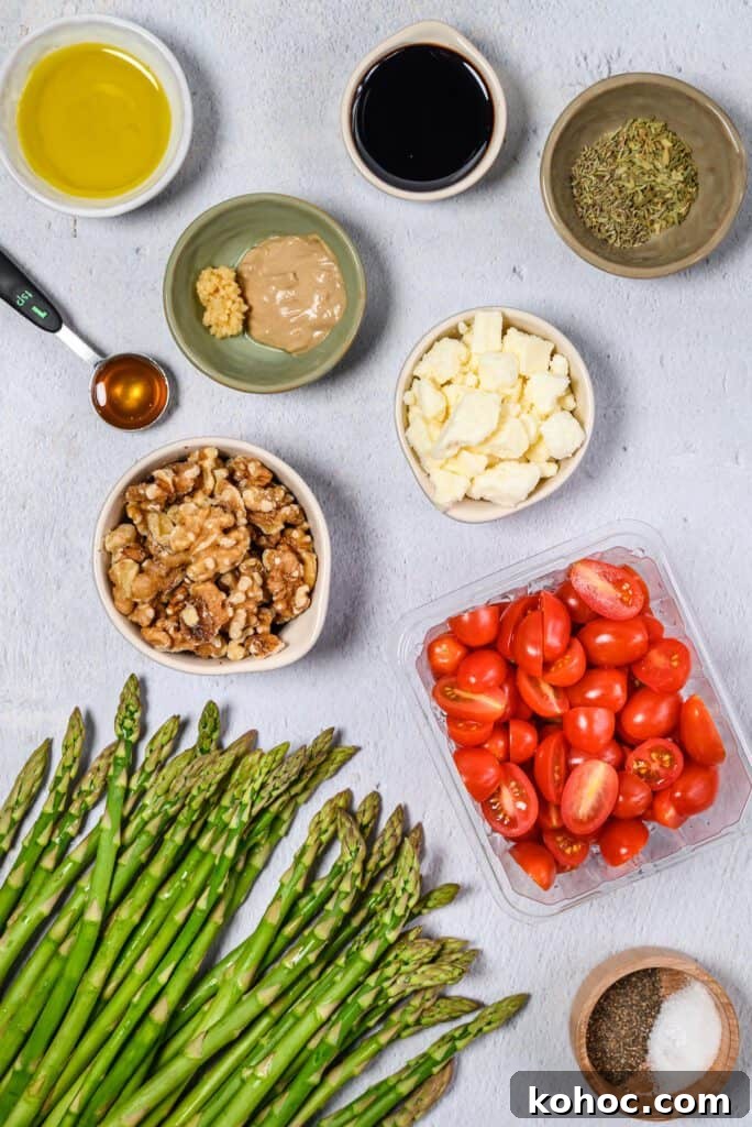 Smalls bowls of ingredients and a bunch of asparagus.
