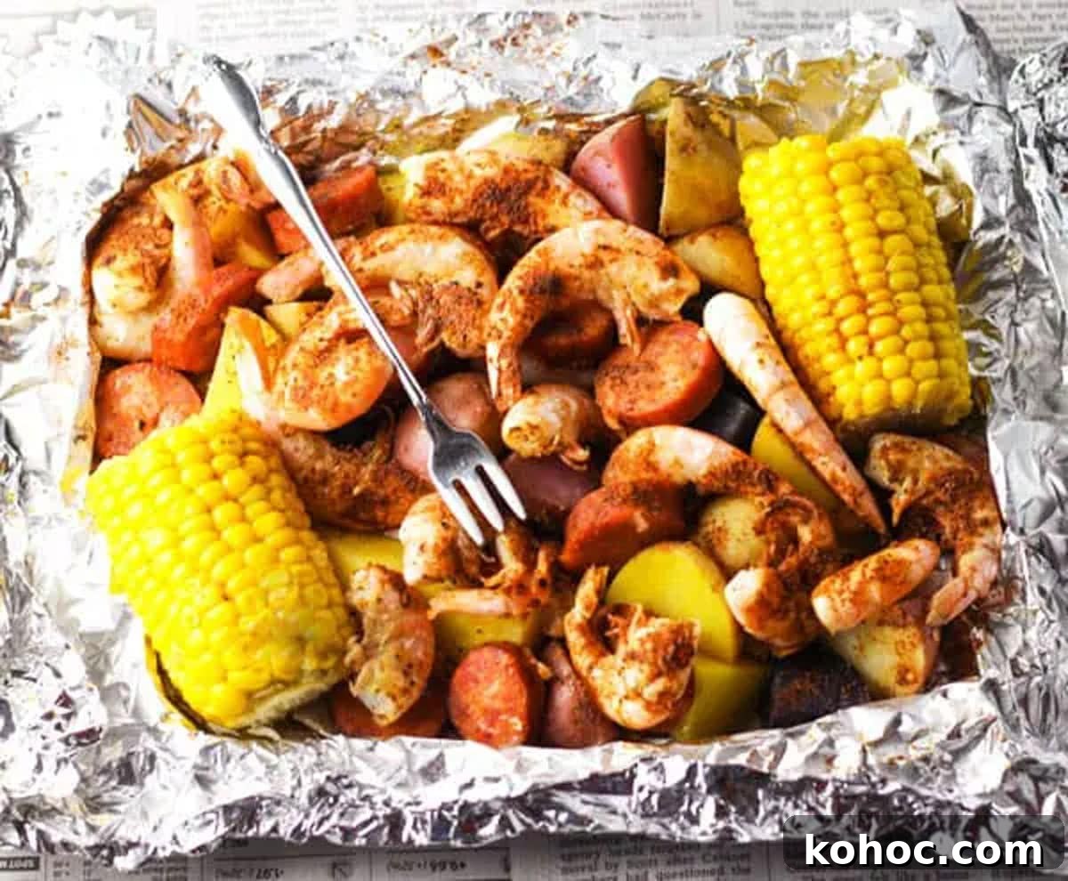 22 Memorial Day Recipes for the Ultimate Backyard BBQ 11 Aluminum foil filled with shrimp, sausage, and corn on the cob.