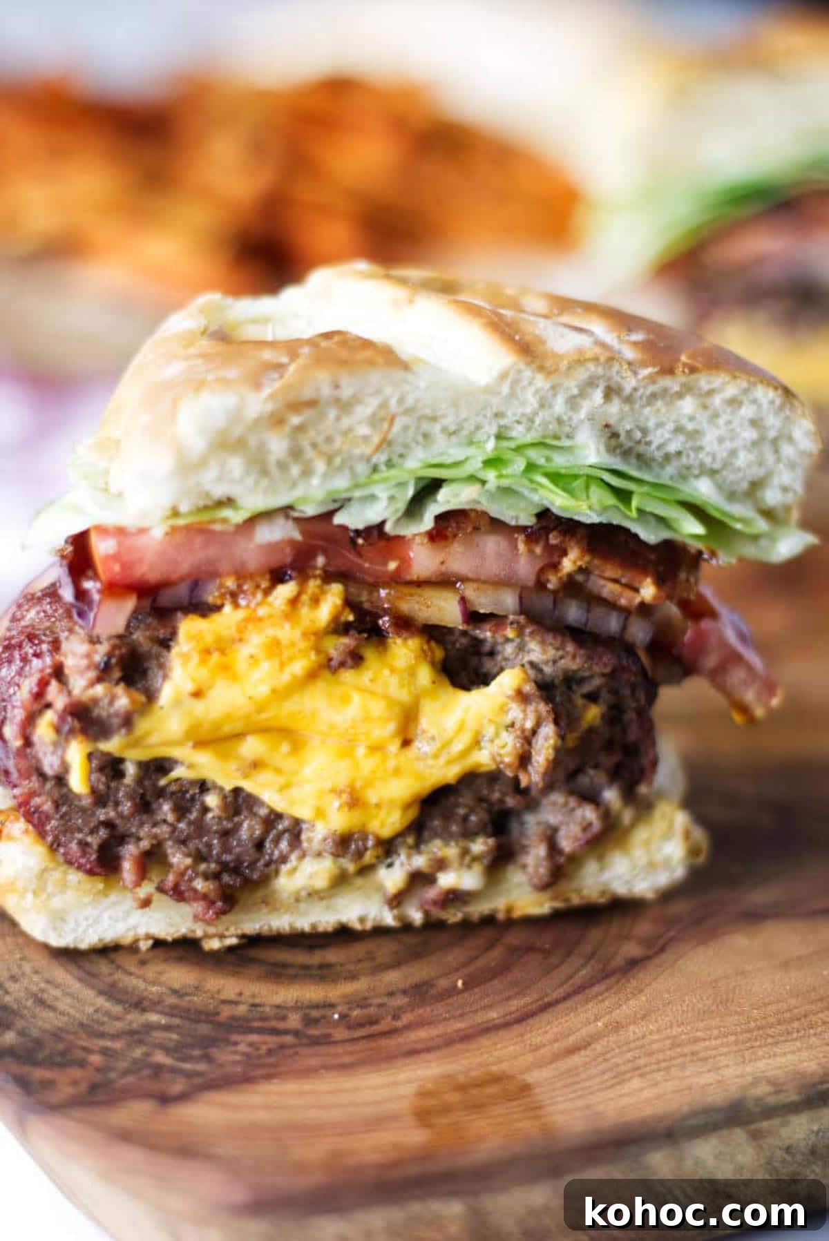 22 Memorial Day Recipes for the Ultimate Backyard BBQ 12 Cheese stuffed hamburger on a grilled bun.