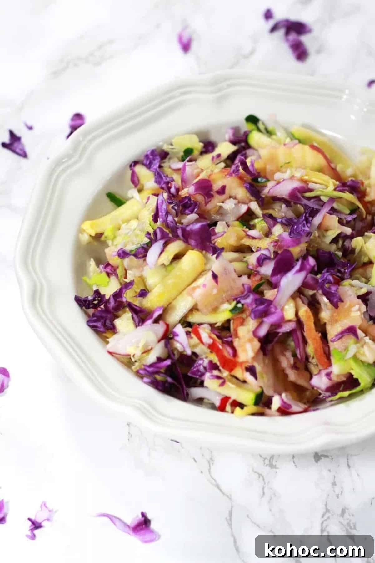 22 Memorial Day Recipes for the Ultimate Backyard BBQ 16 Sweet coleslaw with fruit and vegetables in a bowl.