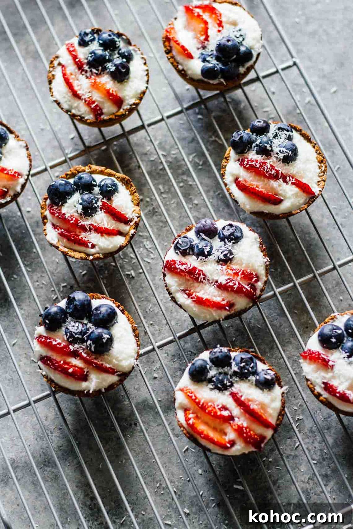 22 Memorial Day Recipes for the Ultimate Backyard BBQ 21 Mini patriotic tarts cooling on a wire rack.