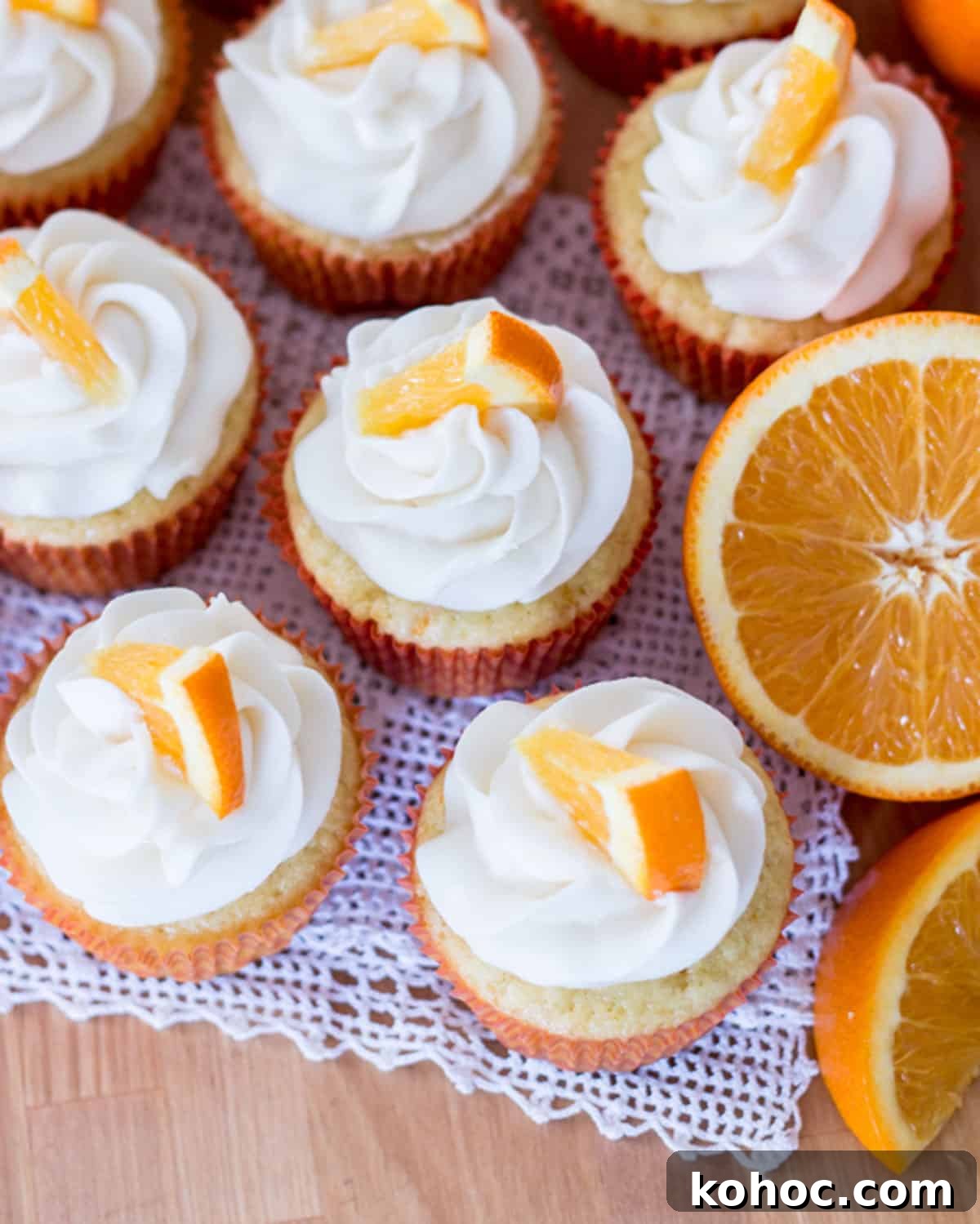 22 Memorial Day Recipes for the Ultimate Backyard BBQ 23 Orange cream filled cupcakes on a table.