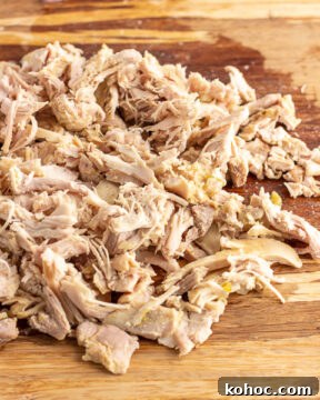 Add shredded chicken to soup.
