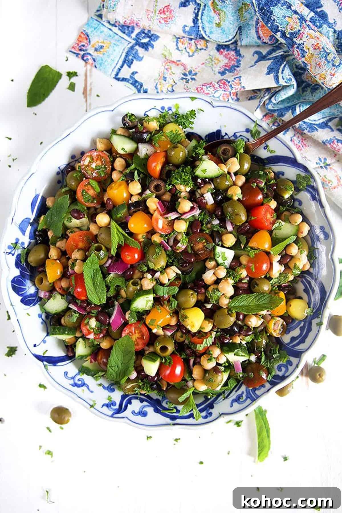 Mediterranean Chickpea Salad with Lemon, Herbs & Feta 2 Overhead shot of Mediterranean Chickpea Salad in a blue and white bowl.