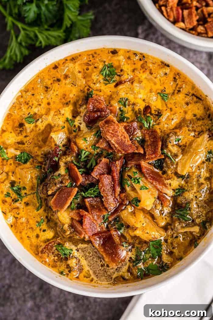 overhead view of bowl of keto cheeseburger soup with bacon on top