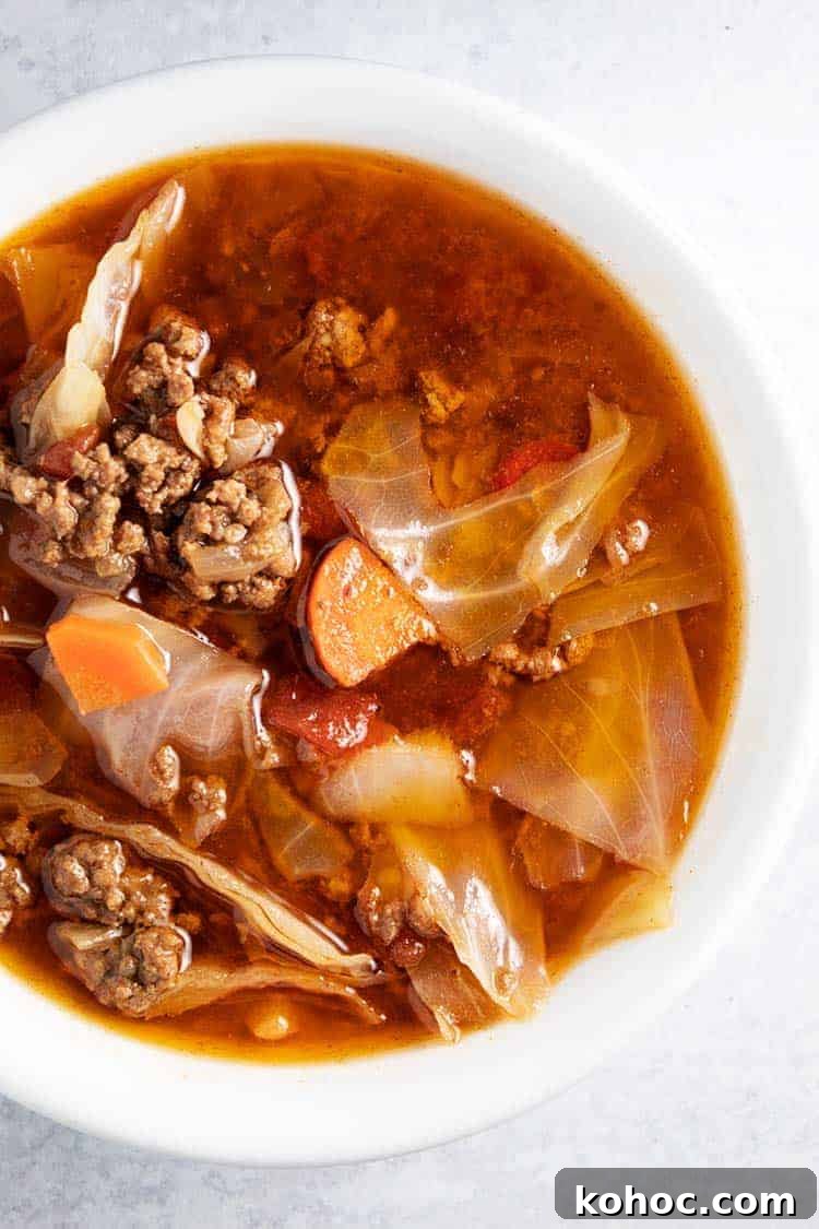 overhead closeup of white bowl of keto cabbage soup