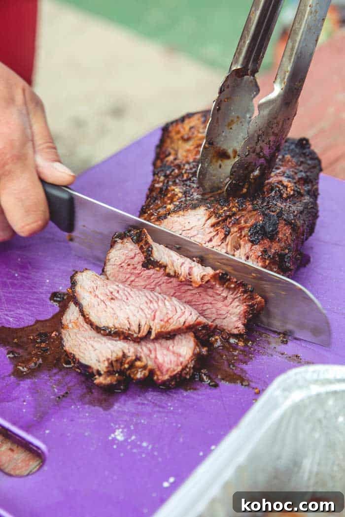 35 Mouthwatering Smoker Recipes for Beef, Ribs, Veg & More 12 smoked tri-tip sliced on chopping board