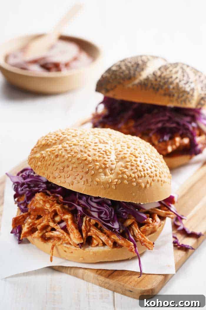 Smoked Pulled Chicken smoked bbq pulled chicken in bread bun and onion slaw