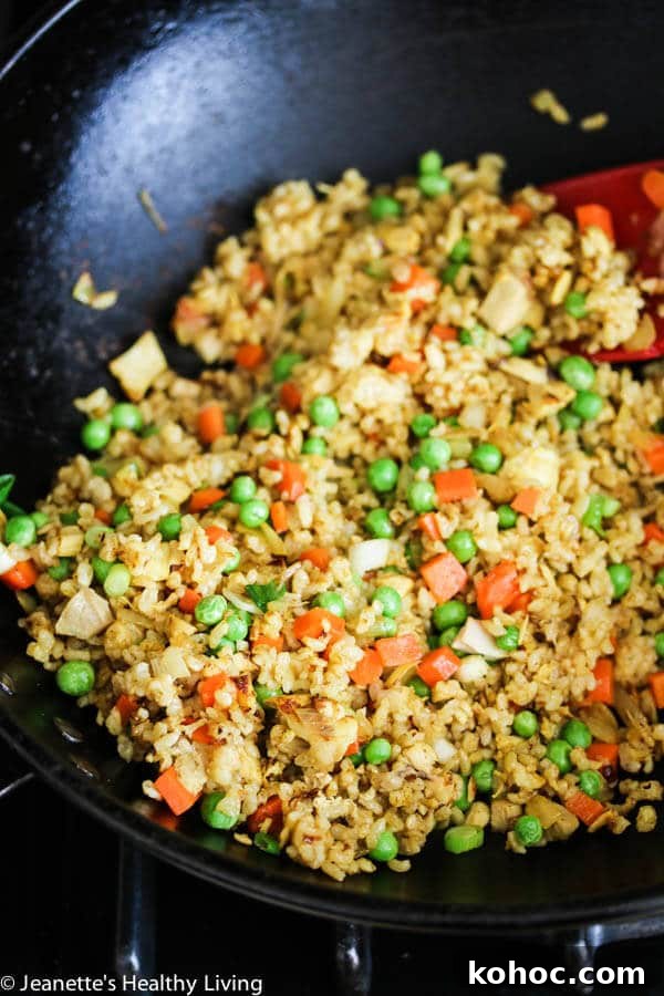 Chicken Curry Fried Rice: Flavorful Weeknight Recipe 3 Chicken Curry Fried Rice - a quick, easy and healthy one-pan dinner made with leftover cooked chicken, brown rice, carrots and peas. Toasted almonds make a nice crunchy topping.