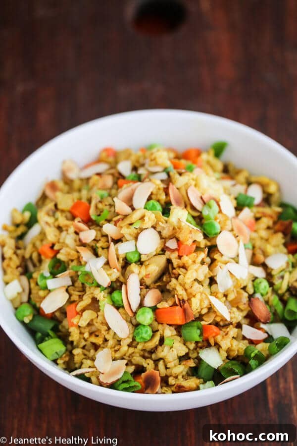 Chicken Curry Fried Rice: Flavorful Weeknight Recipe 6 Chicken Curry Fried Rice - a quick, easy and healthy one-pan dinner made with leftover cooked chicken, brown rice, carrots and peas. Toasted almonds make a nice crunchy topping.