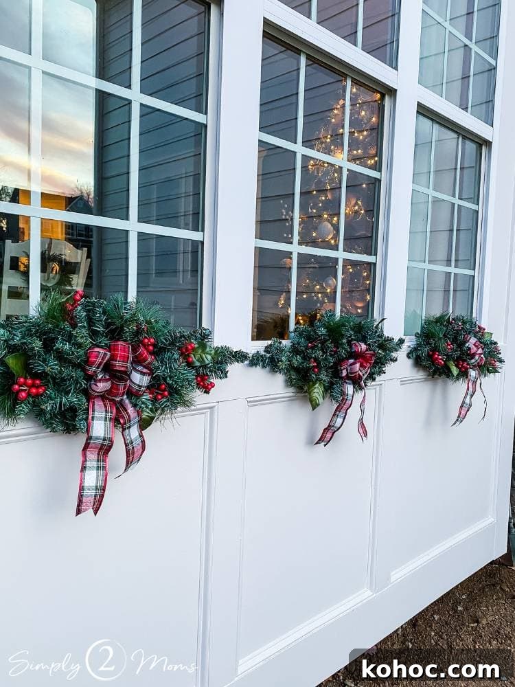 Create Fluffy Christmas Bows in 5 Simple Steps 2 three side by side windows on outside of house with greenery Christmas swags and DIY plaid bows