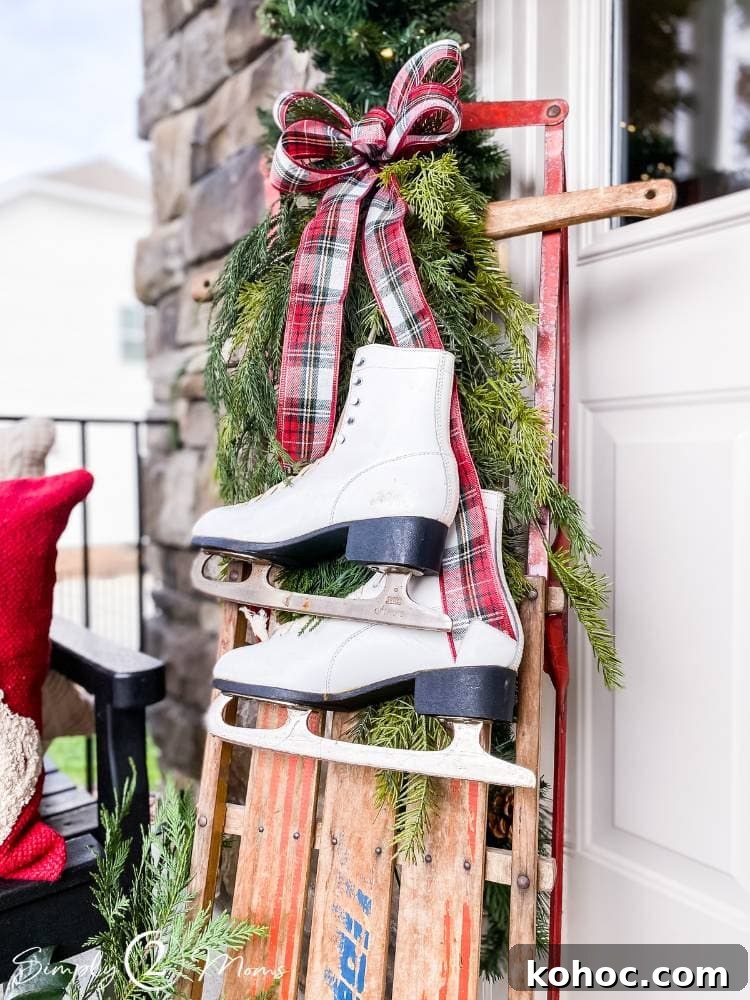 Create Fluffy Christmas Bows in 5 Simple Steps 15 DIY plaid wired ribbon bow hanging with greenery from vintage sled with old ice skates