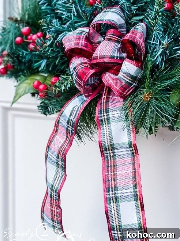 Create Fluffy Christmas Bows in 5 Simple Steps 3 Fluffy plaid christmas bow hanging on garland with holly berries