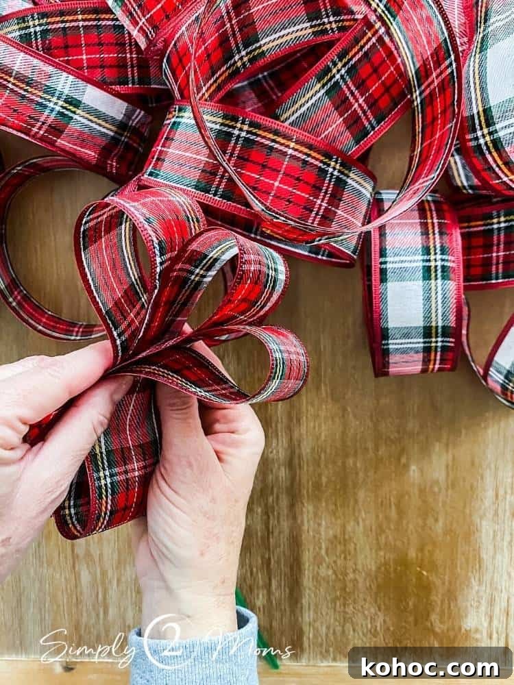 Create Fluffy Christmas Bows in 5 Simple Steps 6 hands holding three loops of ribbon together to create bow