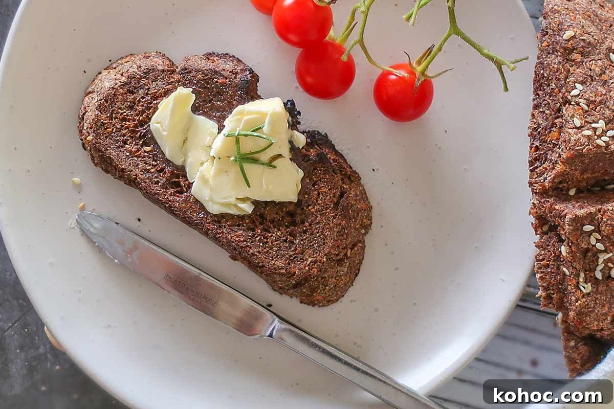 30 Top Gluten-Free Recipes from 2023 You’ll Want to Try 28 slice of toasted flaxseed bread with butte on a small plate