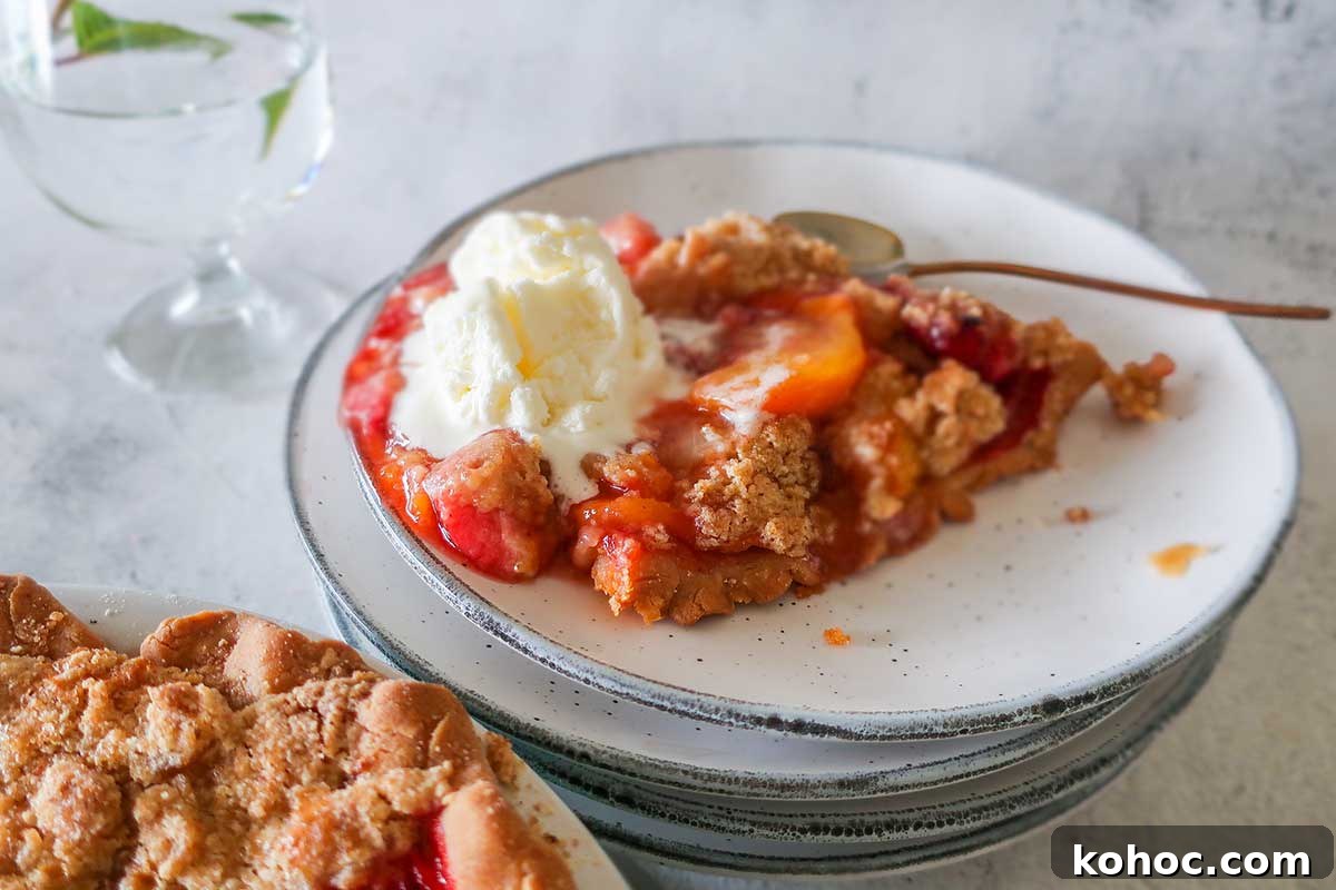 30 Top Gluten-Free Recipes from 2023 You’ll Want to Try 4 slice of peach and strawberry pie on a plate