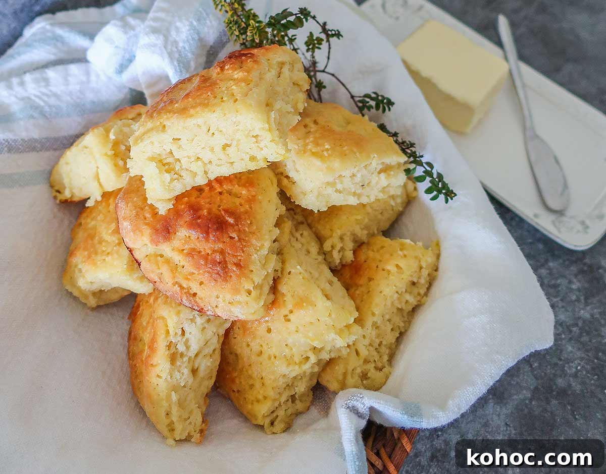 30 Top Gluten-Free Recipes from 2023 You’ll Want to Try 9 gluten free milk rolls in a towel with butter dish on the side