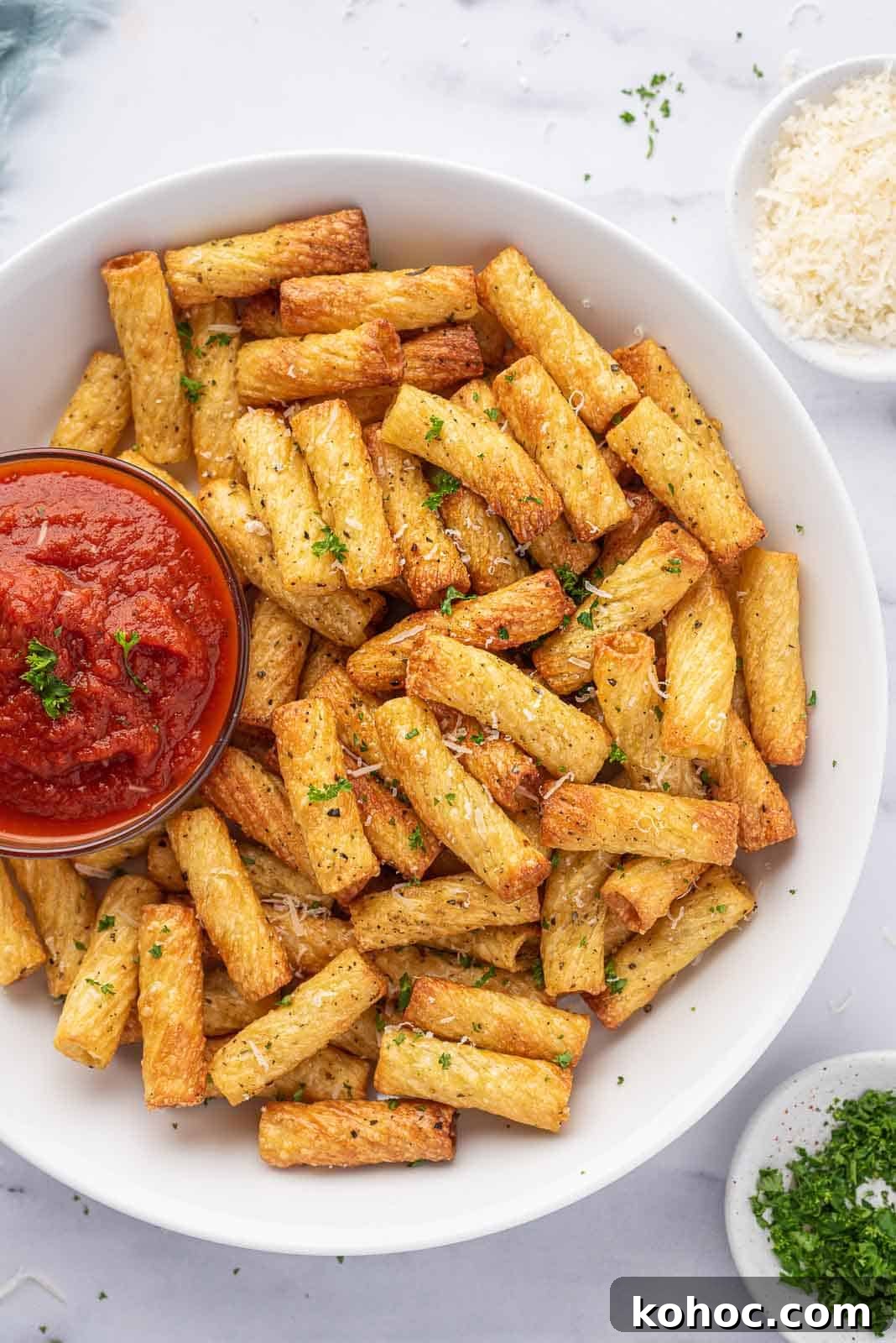 Crispy Air Fryer Pasta Chips Recipe—Quick Snack Idea 8 Air fryer pasta chips on a serving platter with marinara.