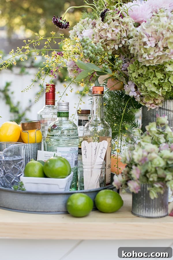 Garden Cocktail Party: Mix & Match Refreshment Bar Ideas 11 Garden cocktail ingredients, limes, garden sticks, spirits and flowers on an outdoor bar.