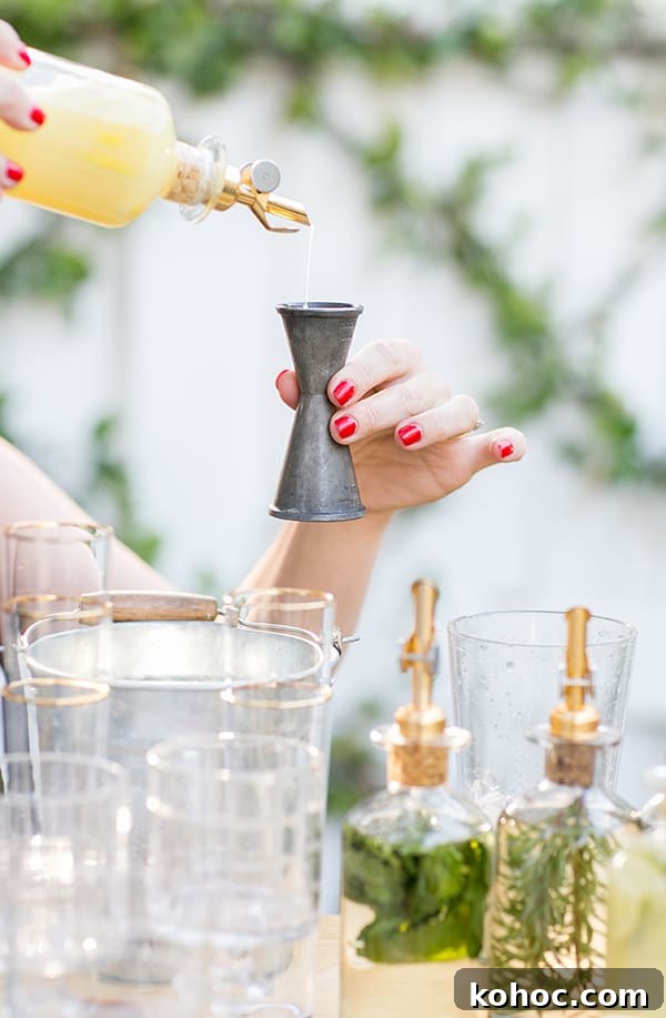 Garden Cocktail Party: Mix & Match Refreshment Bar Ideas 5 Girl pouring juice into a cocktail jigger.