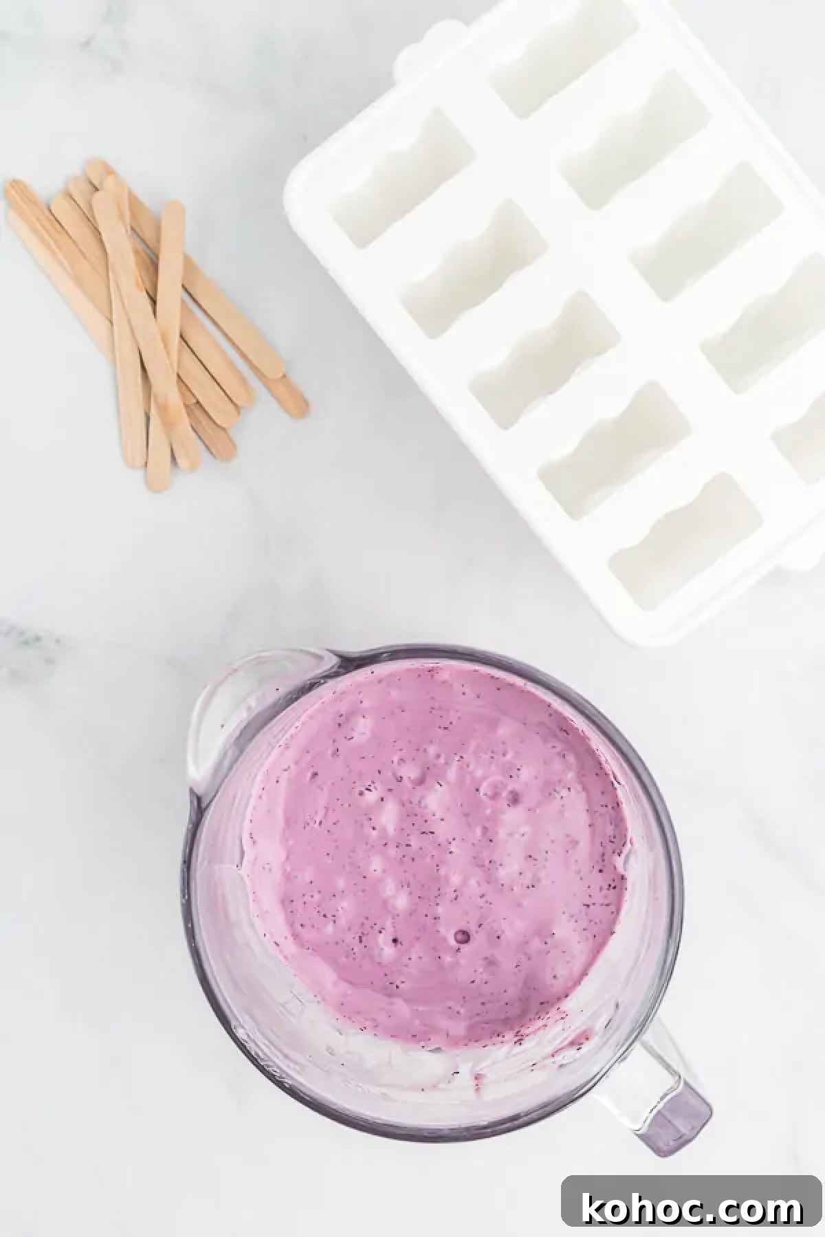 Creamy Blueberry Yogurt Popsicles Recipe for Summer 4 Bowl with ingredients combined together.