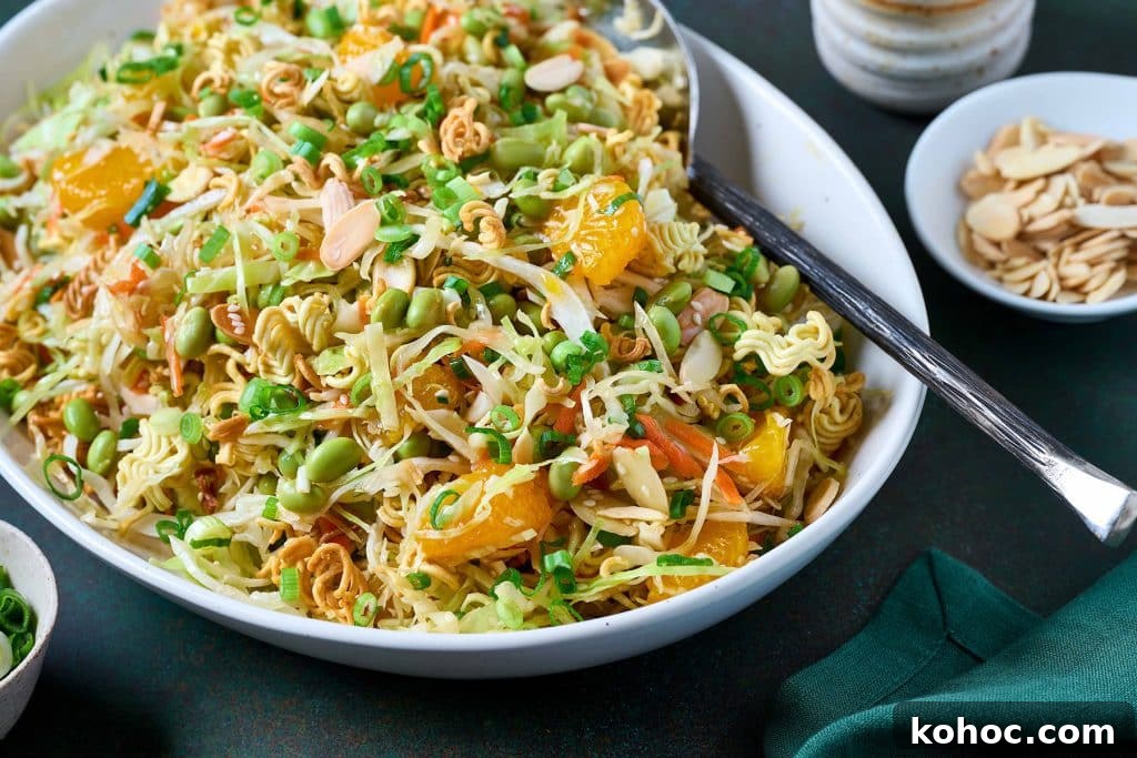 Crunchy Ramen Noodle Salad with Cabbage & Almonds 12 Tossed asian ramen Salad in a bowl.