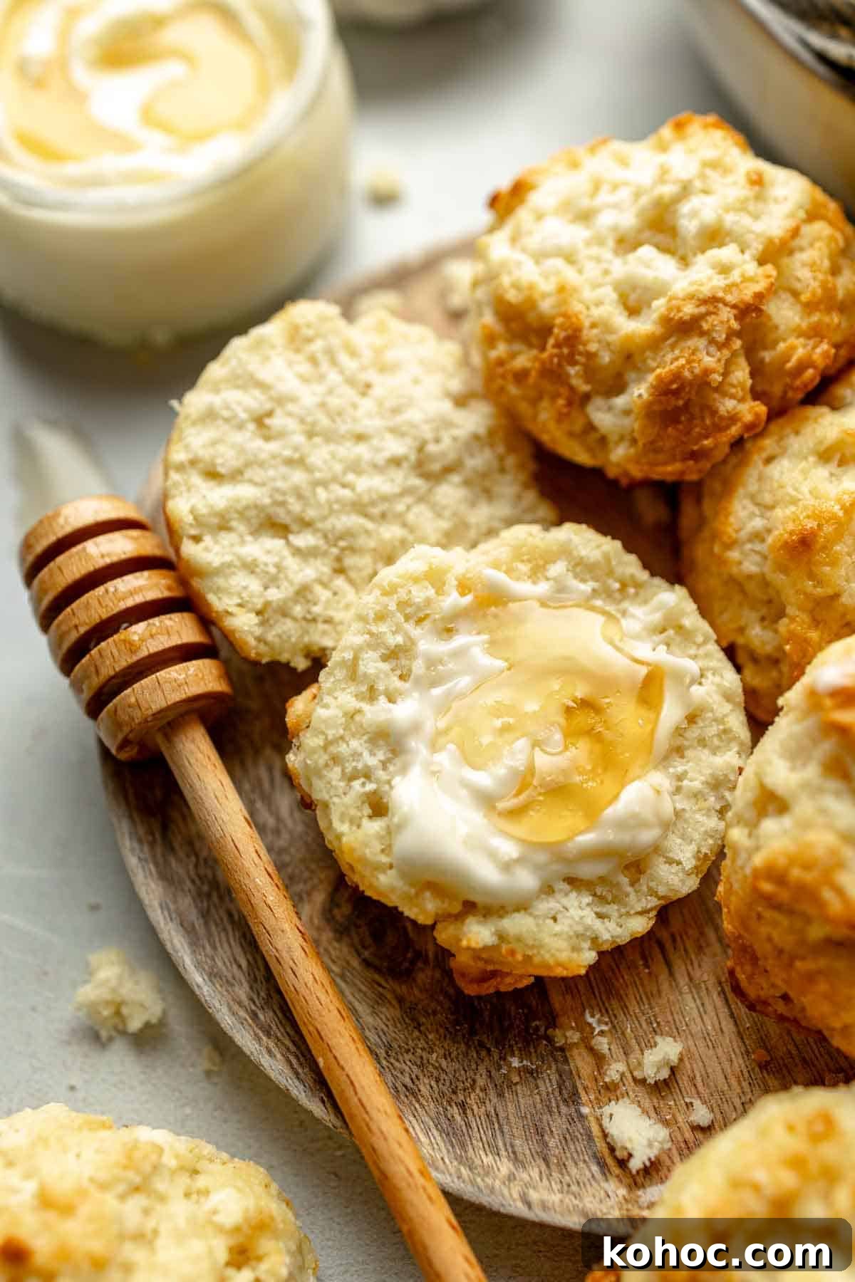Tender Fluffy Gluten-Free Drop Biscuits Recipe for Perfect Results 2 Open face gluten-free drop biscuit slathered with butter and honey.