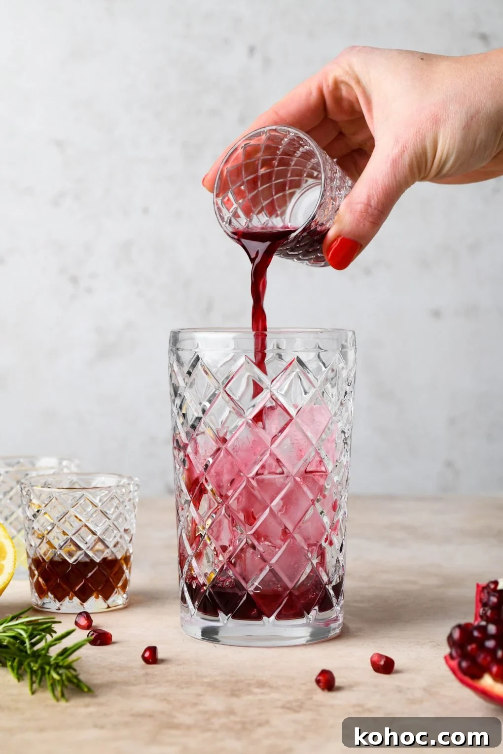 Pomegranate Champagne Cocktail with Gin or Vodka for Holidays 6 How to make Festive Pomegranate Champagne Cocktail: Pouring the pomegranate juice into cocktail shaker.