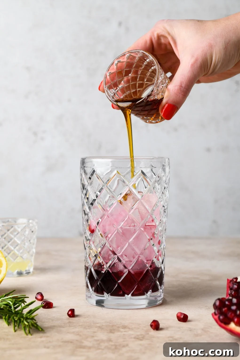 Pomegranate Champagne Cocktail with Gin or Vodka for Holidays 7 How to make Festive Pomegranate Champagne Cocktail: Pouring the maple syrup into cocktail shaker.