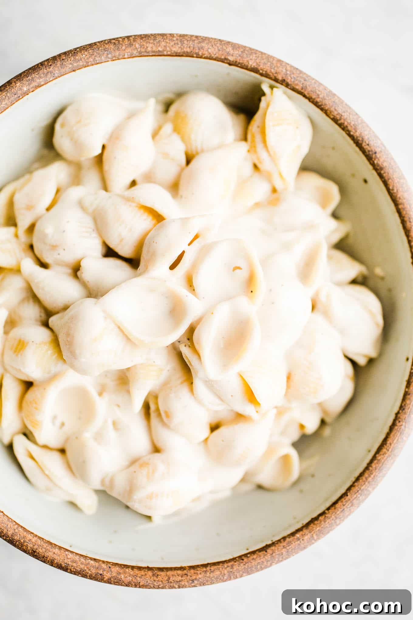 Is Nutritional Yeast Safe for a Gluten-Free Diet? 3 Pasta with alfredo sauce in a rustic bowl.