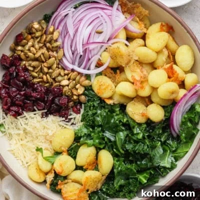 Gnocchi salad with kale, cranberries and pumpkin seeds.
