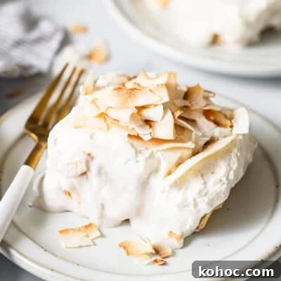 A piece of cake on a white plate.
