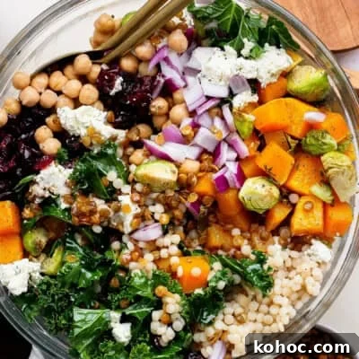 A vibrant couscous salad with roasted squash and cranberries.