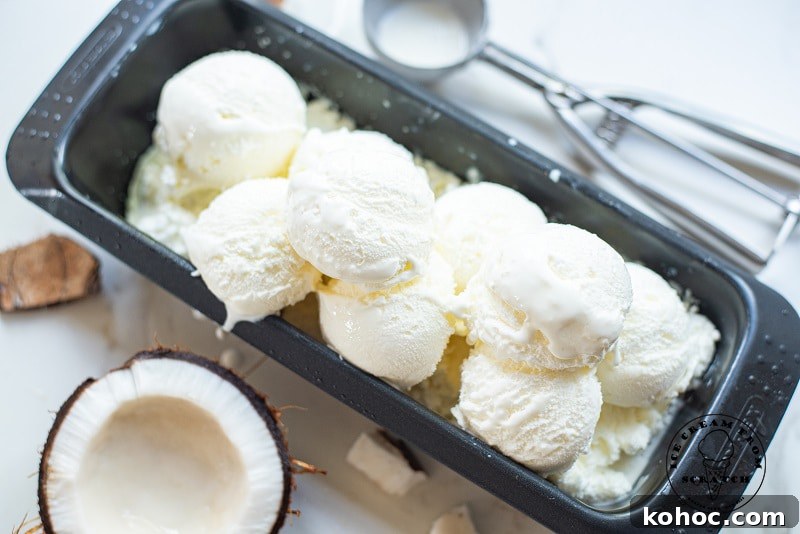 Creamy Homemade Coconut Sorbet Recipe 5 scoops of coconut sorbet in a metal pan