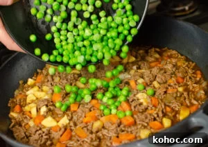 Curried Beef Mince Hotpot Recipe for Comforting Family Dinners 8 peas added to mince