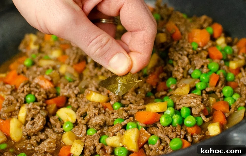 Curried Beef Mince Hotpot Recipe for Comforting Family Dinners 18 Removing the curry leaves from dish