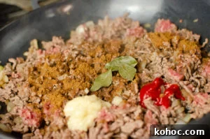 Curried Beef Mince Hotpot Recipe for Comforting Family Dinners 5 Garlic, curry leaves and chilli being added to the mince